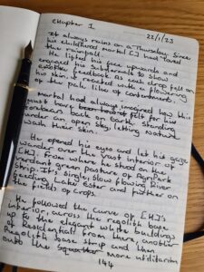 Page of a writing journal showing the hand-written first lines the Sci-Fi novel Judgement